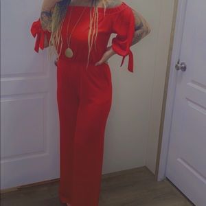 Red silk floor length off the shoulder junpsuit